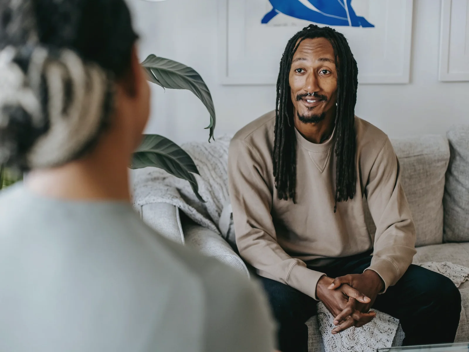Two adults listening to one another during a quiet conversation